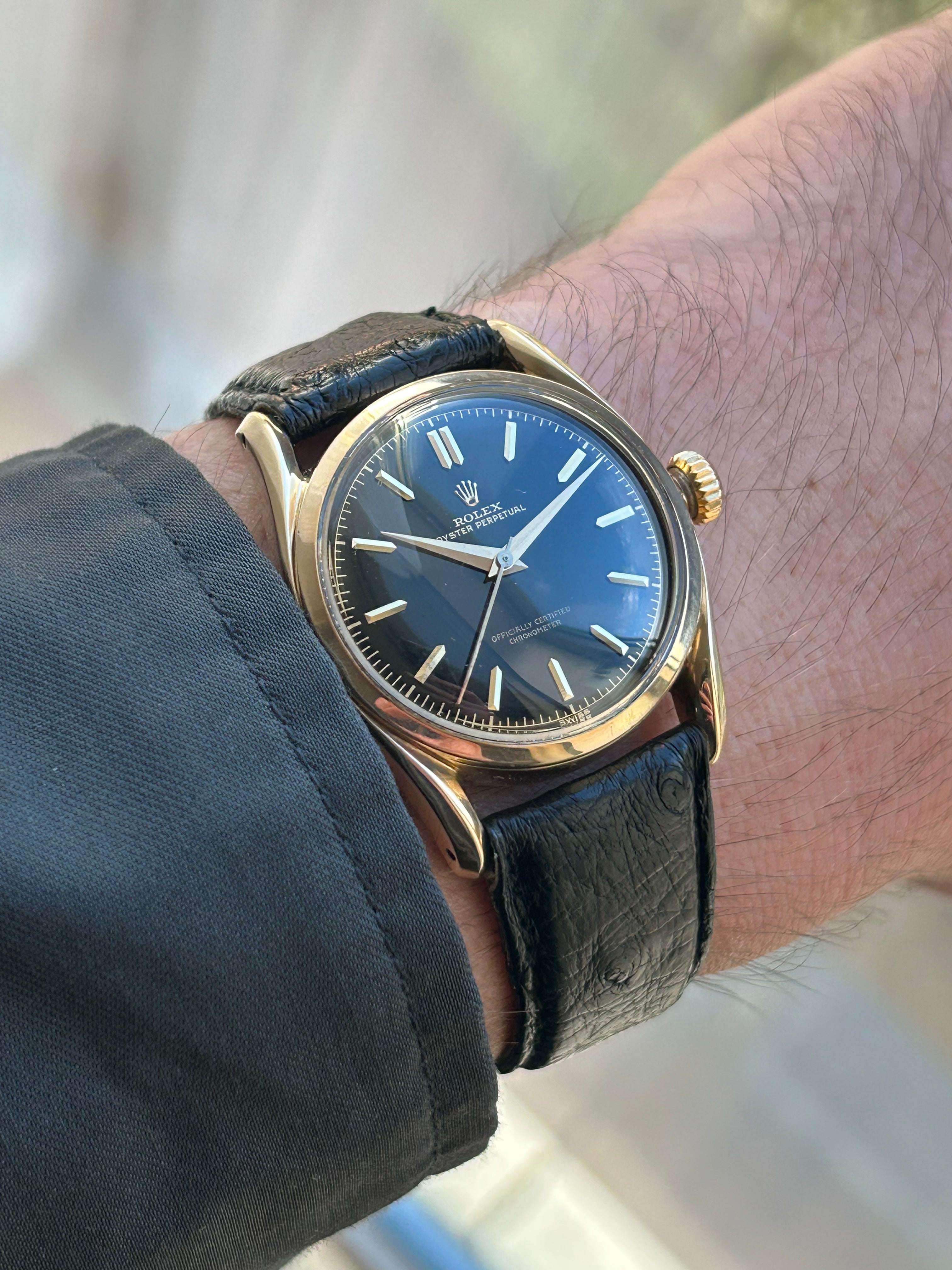 Rolex "Bombay" 6090 in 14k gold with black gilt dial
